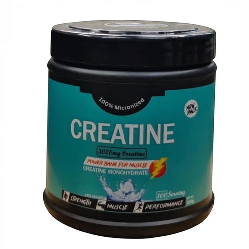 Front view of a black tub with a teal label for 100% Micronized Creatine Monohydrate. The label highlights 3000mg of creatine per serving, describes it as a "Power Bank for Muscle," and notes it is unflavoured, contains 100 servings, and has a net weight of 300g. Icons at the bottom emphasize strength, muscle, and performance.